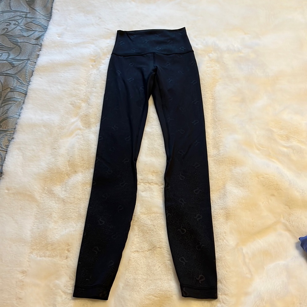 These are Align 28 inch Yogo Emboss black leggings from Lululemon!